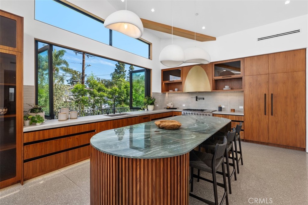 Gourmet kitchen with walnut cabinetry and Italian marble island at 2398 Redlands Drive